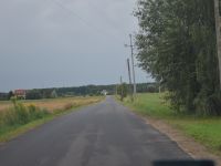 Zdjęcie przedstawia odcinek drogi po zakończeniu prac remontowych